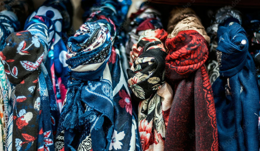 Fototapeta premium Scarves on hangers in a store