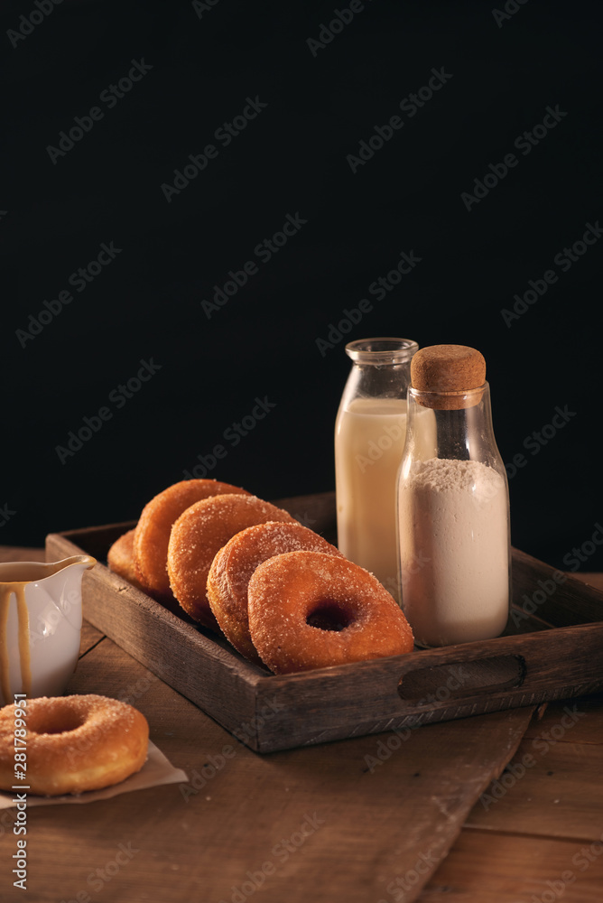 Sugar donuts with a glass of milk Sugar donuts with a glass of milk