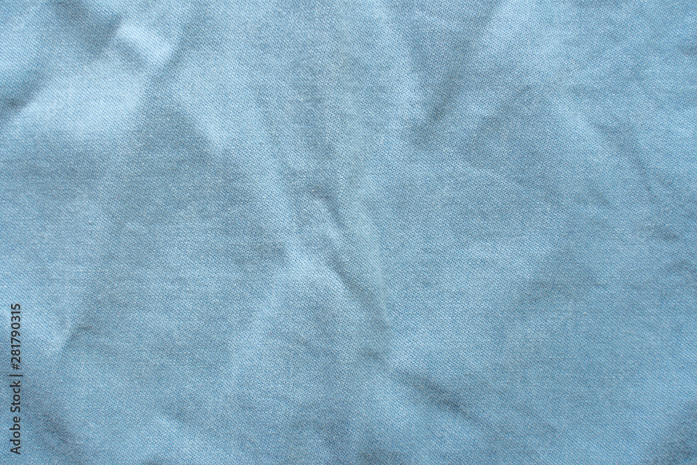 Texture of a Blue Slightly Rumpled Shirt. Empty Backdrop Texture of a Blue Slightly Rumpled Shirt. Empty Backdrop