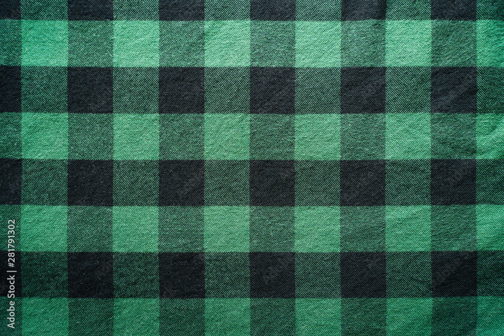Fabric in a cage. Black and green square pattern. Clothes Empty Background Fabric in a cage. Black and green square pattern. Clothes Empty Background