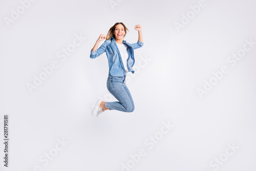 Full length body size photo of screaming shouting lady raising gesturing fists up flying in the air isolated grey background