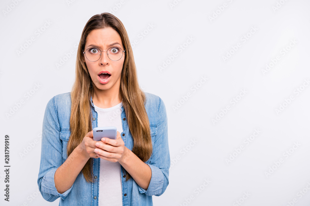 Close up photo portrait of nice glad pretty holding using telephone in hands isolated grey background copyspace Close up photo portrait of nice glad pretty holding using telephone in hands isolated grey background copyspace