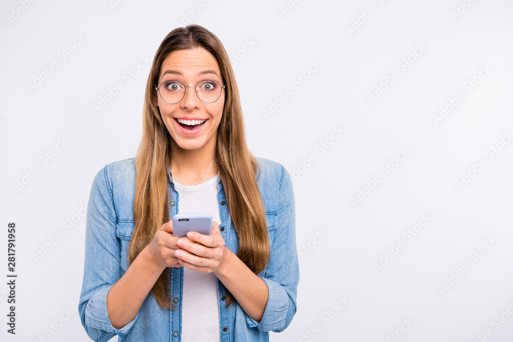 Photo portrait of pretty glad optimistic beautiful teenager using getting newly bought cellular isolated grye background copy space Photo portrait of pretty glad optimistic beautiful teenager using getting newly bought cellular isolated grye background copy space