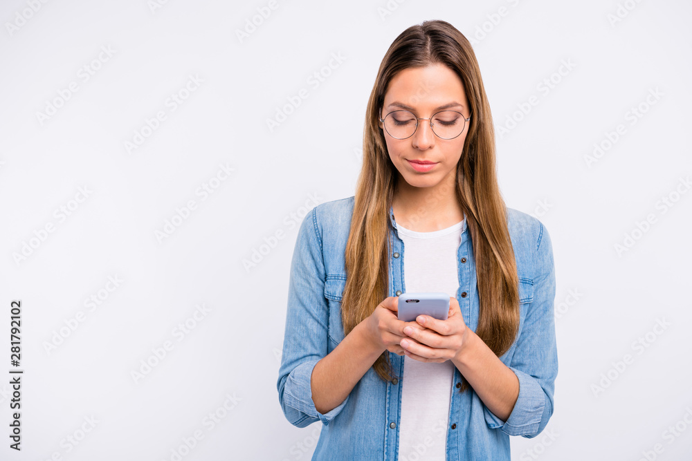 Close up photo of beautiful nice satisfied lady checking her telephone isolated grey background Close up photo of beautiful nice satisfied lady checking her telephone isolated grey background