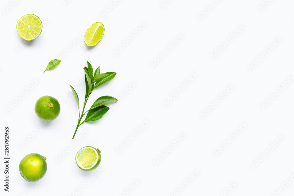Limes with leaves isolated on white background.