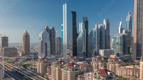 Aerial view of skyscrapers and road junction in Dubai timelapse