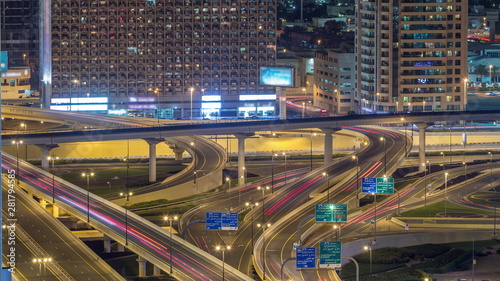 Aerial view of highway interchange in Dubai downtown night timelapse. © neiezhmakov
