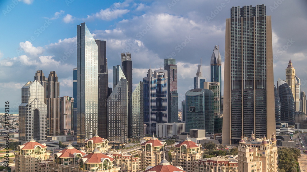 Obraz premium Aerial view on downtown and financial district in Dubai timelapse, United Arab Emirates with skyscrapers and highways.