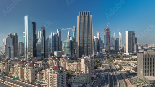 Skyline view of the buildings of Sheikh Zayed Road and DIFC timelapse in Dubai, UAE. © neiezhmakov