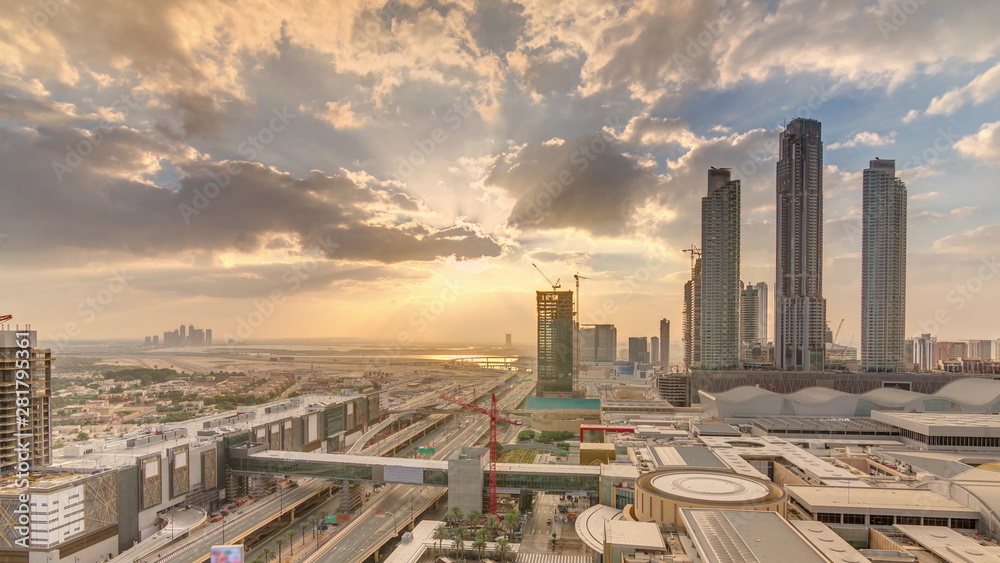 Obraz premium Sunrise aerial view of Financial center road morning timelapse with under construction building