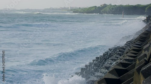 Slow motion footage of wave crashing on breakwater, Japan photo