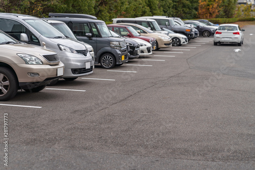 row of cars parked in outdoor parking