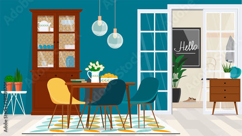 Danish style living room design with wooden furniture against a turquoise wall and a door to the entrance hall.