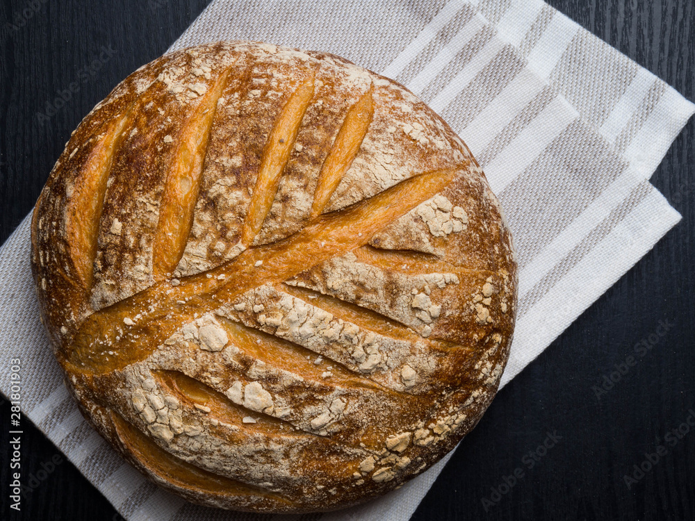 Freshly baked traditional bread on wooden table Freshly baked traditional bread on wooden table