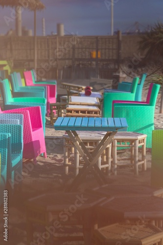 Fototapeta Naklejka Na Ścianę i Meble -  Summer terrace cafe, colorful multi colored chairs and tables outside. Concept food