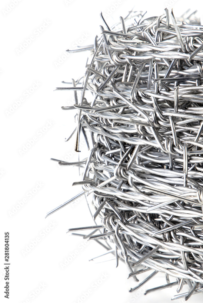 Close up A bundle of Galvanized Barbed Wire or Barb Wire Fencing with sharp edges isolated on white background.