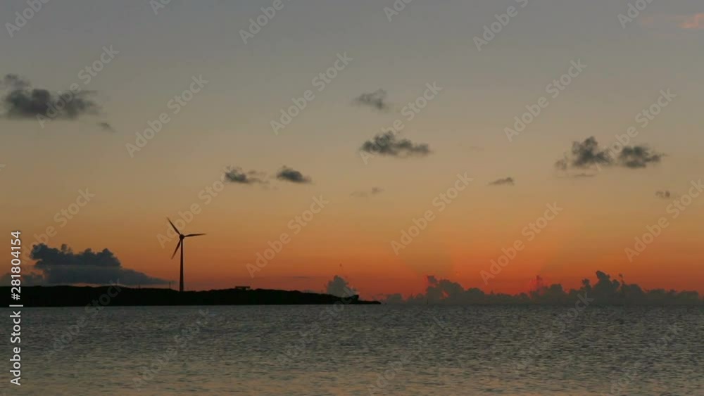 Wind turbine on seashore at sunset, Miyako Island, Okinawa, Japan Wind turbine on seashore at sunset, Miyako Island, Okinawa, Japan