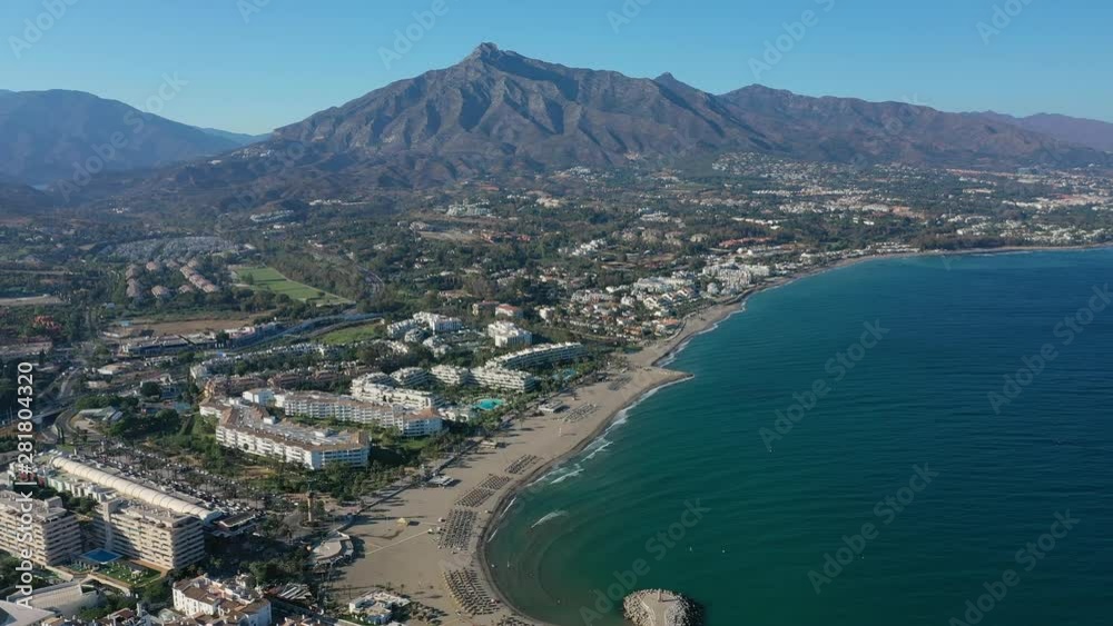 Aerial view of cityscape of Marbella, famous summer resort city and tourist destination in Costa del Sol, beaches and Mediterranean Sea - landscape panorama of Andalusia from above, Spain, Europe Aerial view of cityscape of Marbella, famous summer resort city and tourist destination in Costa del Sol, beaches and Mediterranean Sea - landscape panorama of Andalusia from above, Spain, Europe