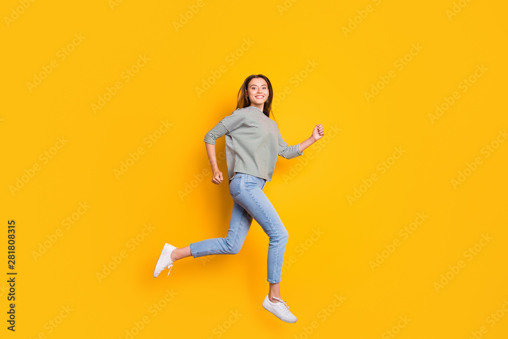 Full length body size photo of excited cheerful girlfriend running towards her dreams while isolated with yellow background - obrazy, fototapety, plakaty 