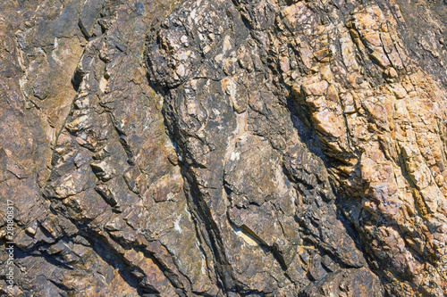 Texture of coastal mountain cliff in Montenegro on a sunny day, background