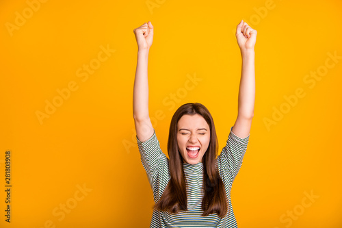 Photo of excited encouraged girl having finally divorced with her bad husband while isolated with yellow background photo