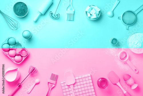 Bakery ingredients over trendy neon pink and blue color background - butter, sugar, flour, eggs, oil, spoon, rolling pin. Baking frame, cooking concept. Top view, copy space. Flat lay