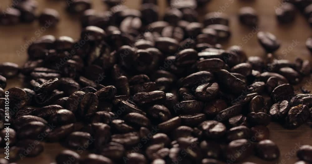 Close Up Slow Motion 4K Of Delicious Coffee Beans Falling Dropping On To Rustic Wooden Table Filling The Table And Shot Close Up Slow Motion 4K Of Delicious Coffee Beans Falling Dropping On To Rustic Wooden Table Filling The Table And Shot