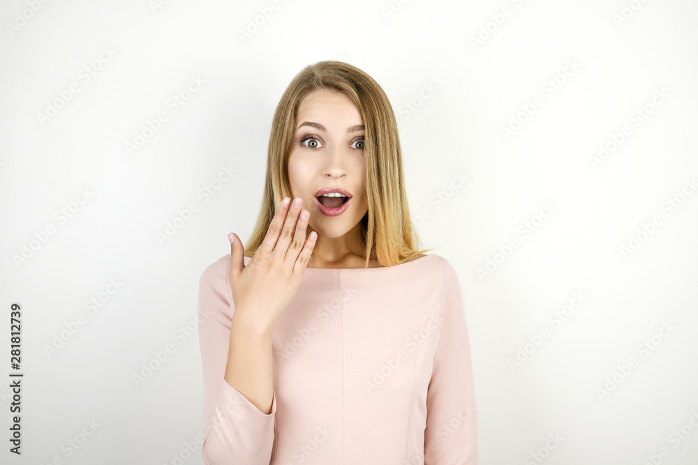 young beautiful blonde amazed woman on isolated white background young beautiful blonde amazed woman on isolated white background