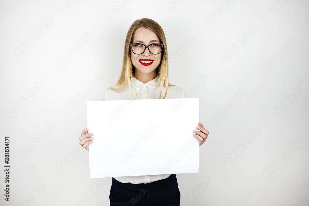 young beautiful woman in eyeglasses holding blank sheet of paper isolated white background space for text young beautiful woman in eyeglasses holding blank sheet of paper isolated white background space for text