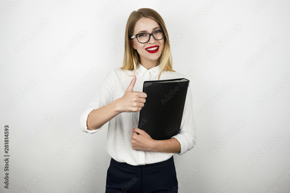 young beautiful business woman in eyeglasses holding black folder with documents showing ok sign isolated white background young beautiful business woman in eyeglasses holding black folder with documents showing ok sign isolated white background