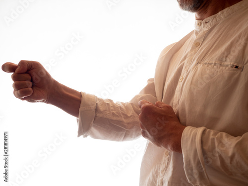 Human hand training in karate, tai-chi, martial arts. White shirt on white background.
