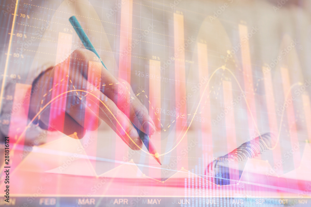 Financial forex graph displayed on hands taking notes background. Concept of research. Double exposure Financial forex graph displayed on hands taking notes background. Concept of research. Double exposure