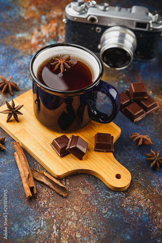 Hot winter tea with cinnamon stick and chocolate
