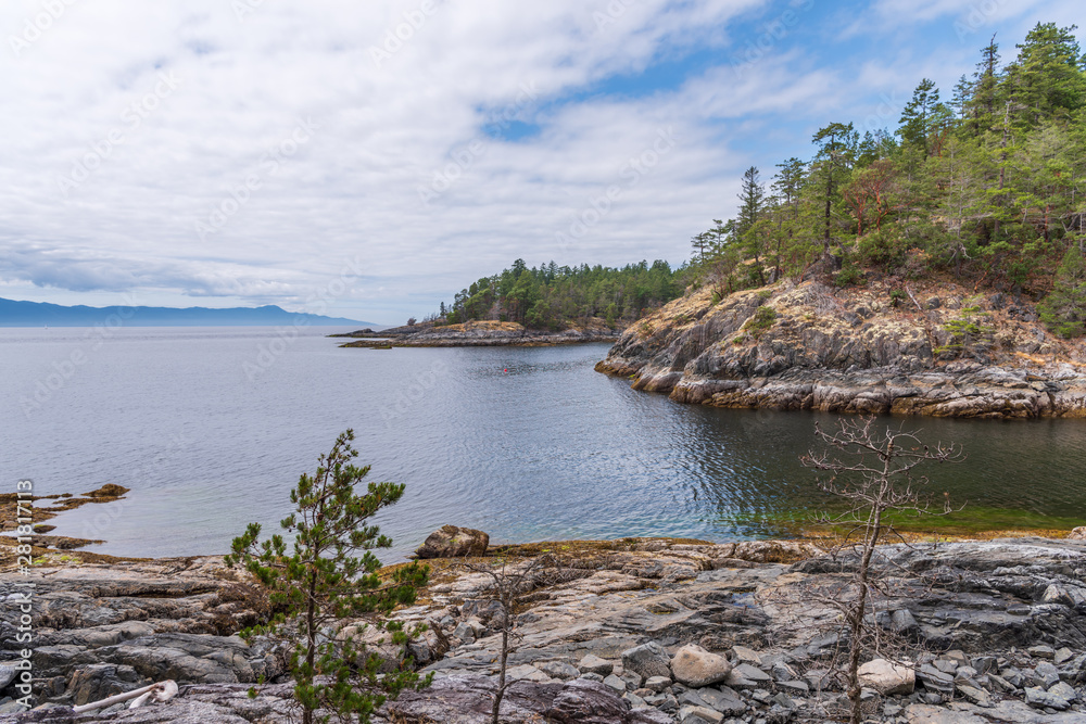 View over Inlet, ocean and island with boat and mountains in beautiful British Columbia. Canada. View over Inlet, ocean and island with boat and mountains in beautiful British Columbia. Canada.