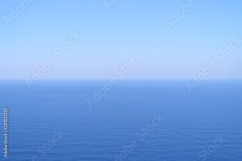 Calm sea and blue clear sky photo