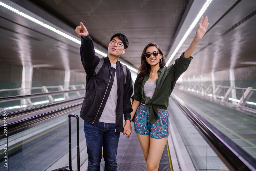 A young and attractive diverse interracial Asian couple (Korean man, Indian woman) are on their