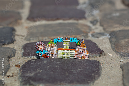 Lviv souvenir magnet on cobblestone pavement photo