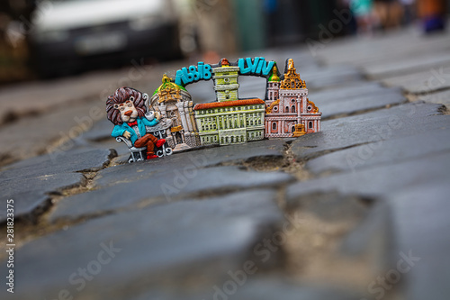 Lviv souvenir magnet on cobblestone pavement photo