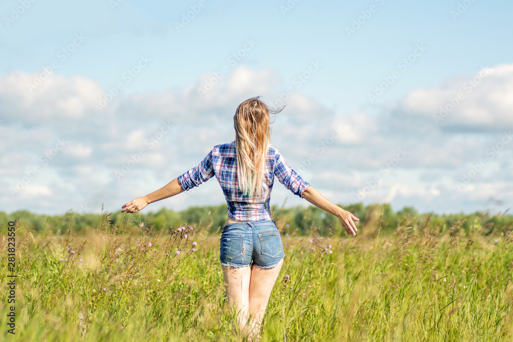 happy beautiful girl in the blooming field enjoying the sun and flowers happy beautiful girl in the blooming field enjoying the sun and flowers