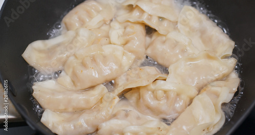 Fry Chinese meat dumpling in skillet pan
