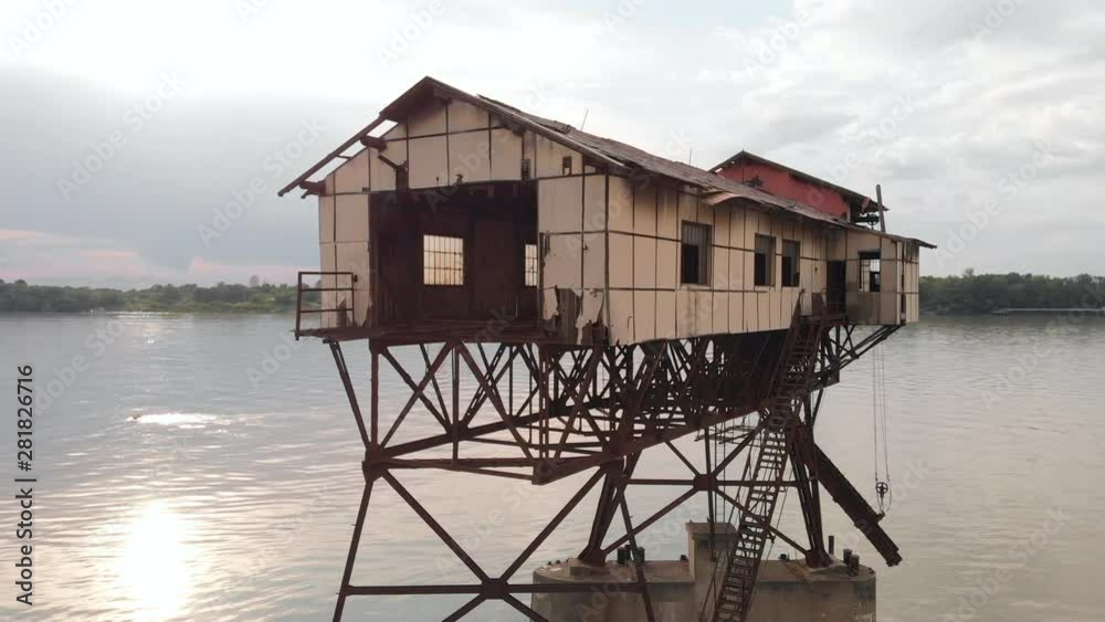 Slow Aerial Arc Around Old Coal Load Station On Danube River In Hungary. Slow Aerial Arc Around Old Coal Load Station On Danube River In Hungary.