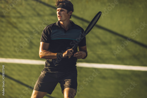 Tennis player practicing tennis on a club court © Jacob Lund