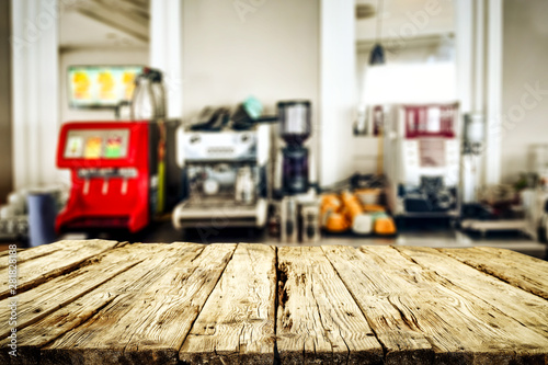 Wooden table background with blurred bar view. Empty space for products and decoration.