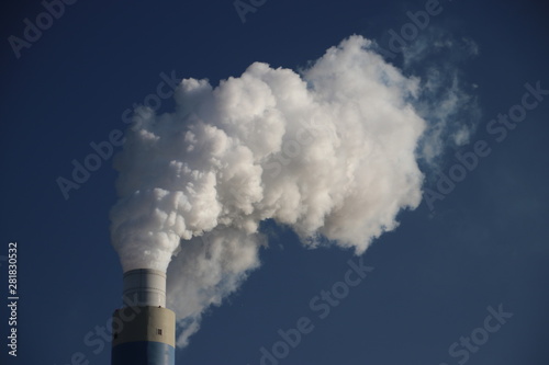 water vapour coming from the chimney of the coal power plant of Engie on the Maasvlakte harbour in Rotterdam photo