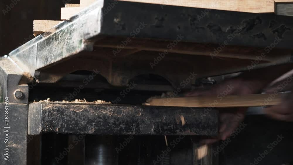 Machine for wood cutting.Wooden flakes at a background Machine for wood cutting.Wooden flakes at a background