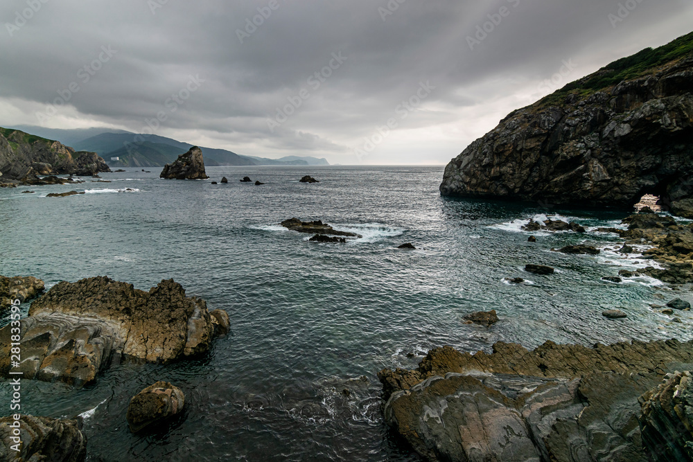 Photograph of rock formations, taken from the viewpoint of San Juan de Gaztelugatxe, famous for being the scene of the Game of Thrones series