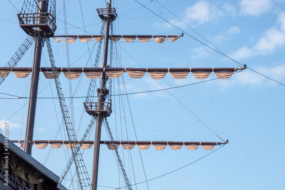 Mast sailing ship against blue sky