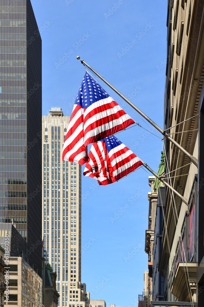 American flag on background of famous skyscrapers in downtown Manhattan. New York City. United States