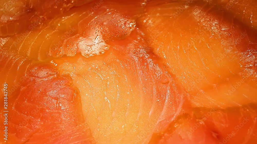 Smoked Salmon Fillet Slices Closeup Texture on Rotating Plate Smoked Salmon Fillet Slices Closeup Texture on Rotating Plate