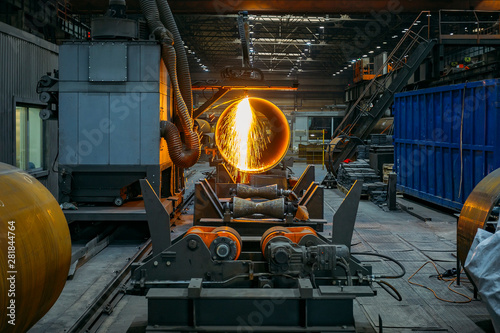 Plasma cutting machine with CNC cutting steel pipe with sparks © Mulderphoto